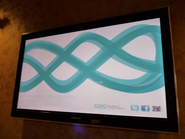 Academic Technologies logo displayed on flat screen tv in Undergraduate Learning Center