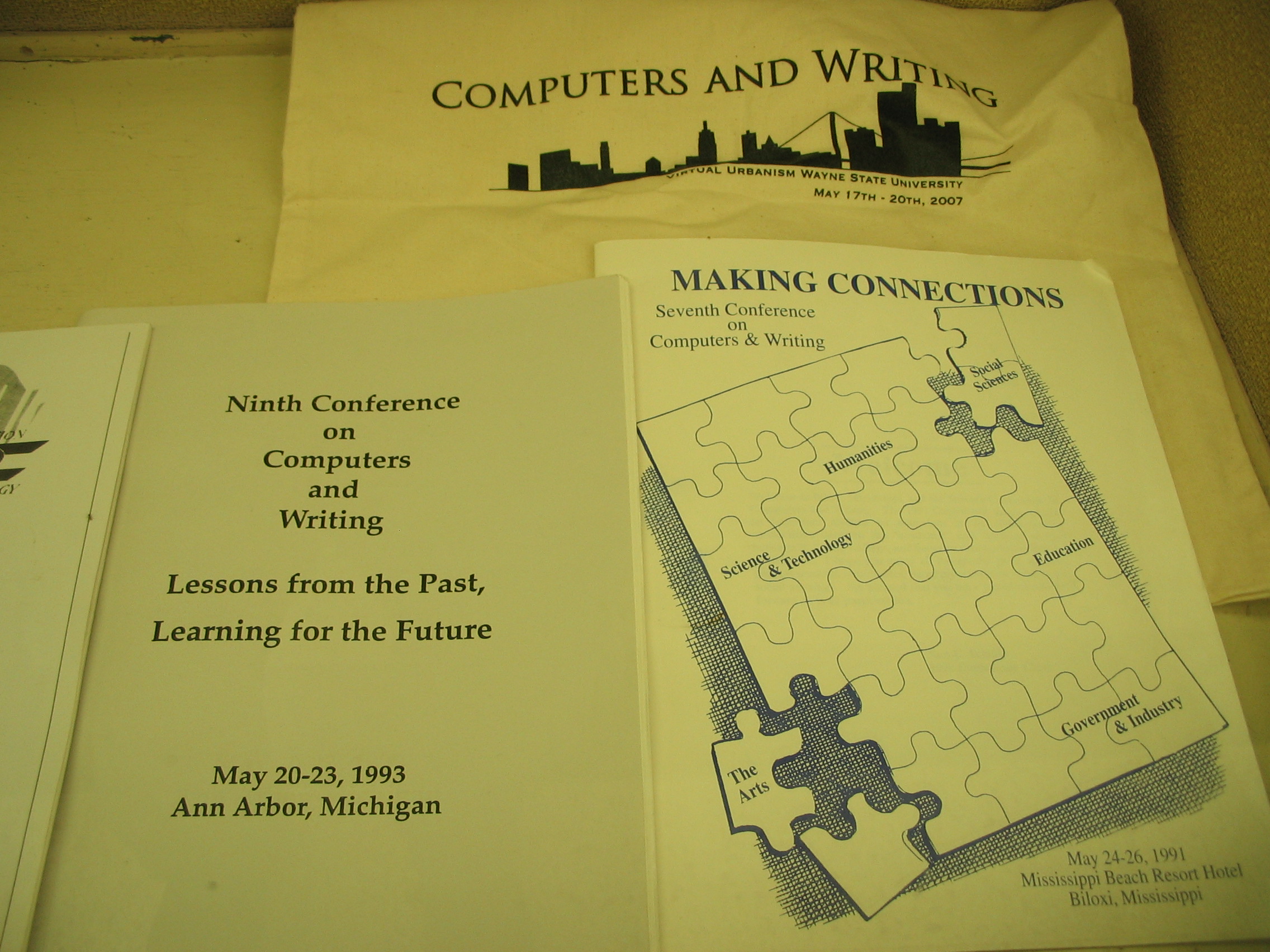 Programs from the 1991 and 1993 Computers and Writing Conferences at Biloxi, Mississippi and Ann Arbor, Michigan, and a tote bag from the 2007 Computers and Writing Conference in Detroit