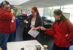 DRC Wiki Editors Shelley Rodrigo and Stephanie Vie stand with DRC Fellow Jenae Cohn at the DRC C&W 