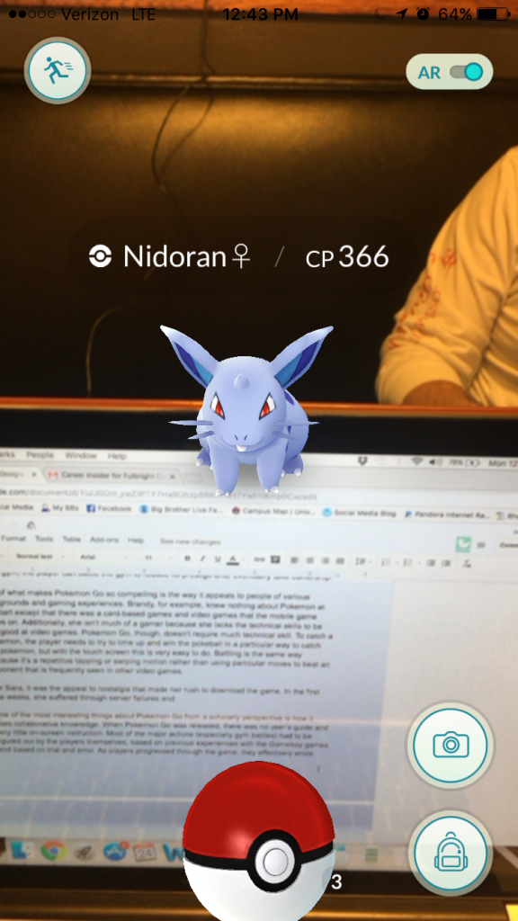 Screen capture of catching a Nidoran over a draft of this blog entry
