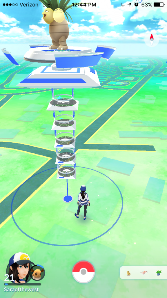 Virtual player on the game map. Large blue/silver structure is a Team Mystic controlled grym. Smaller blue boxes (across the road) indicate Pokéstops. Right-hand icon displays player avatar and level; left-hand menu displays recently sighted Pokémon in the area.