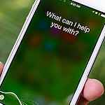 Image of an iphone screen with the words "what can I help you with?" on the screen.
