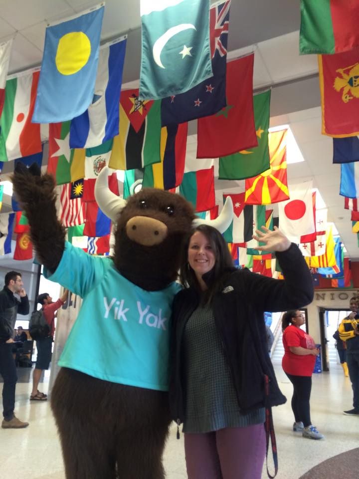 Yik Yak mascot and Sara West, waving