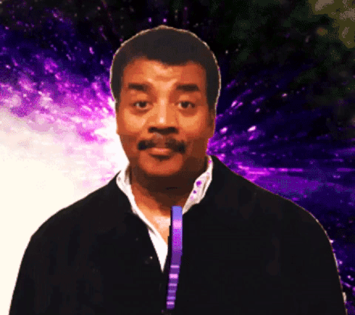 Neil Degrasse Tyson with fireworks behind his head; animated text reads 'Mind blown.'